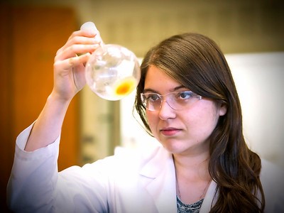 Student holding bottle 